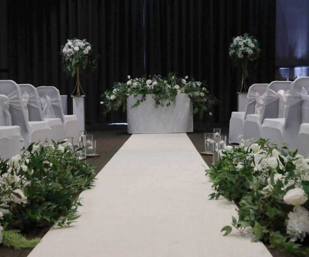 White ceremony wedding flowers with foliage North West florists