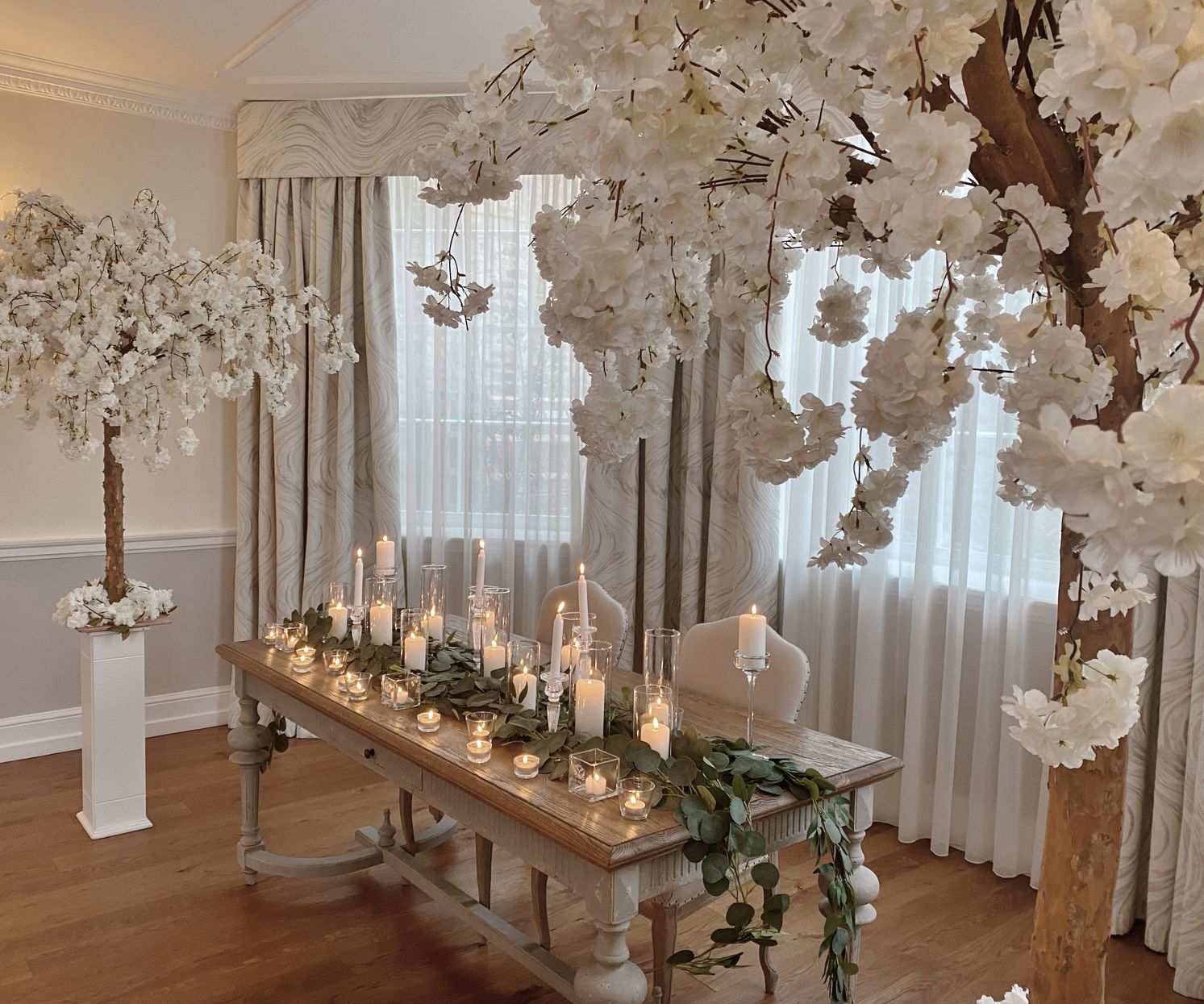 Wedding ceremony aisle style blossom trees and candles