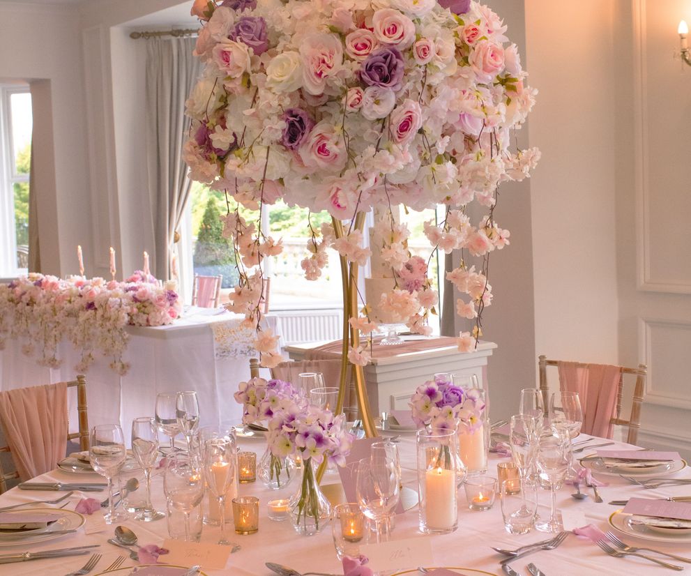 Pink and white blossom wedding table centre pieces in Cheshire