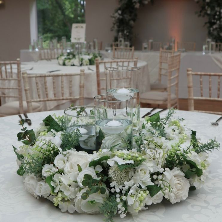 White flowers with greenery floral wreath and candles to hire Cheshire
