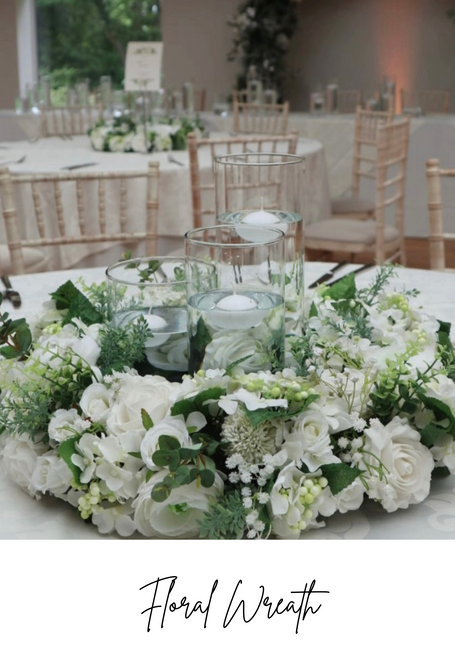 Wedding table floral wreath centre pieces to hire with cylinder vases candles venue dressing in Cheshire and Manchester 