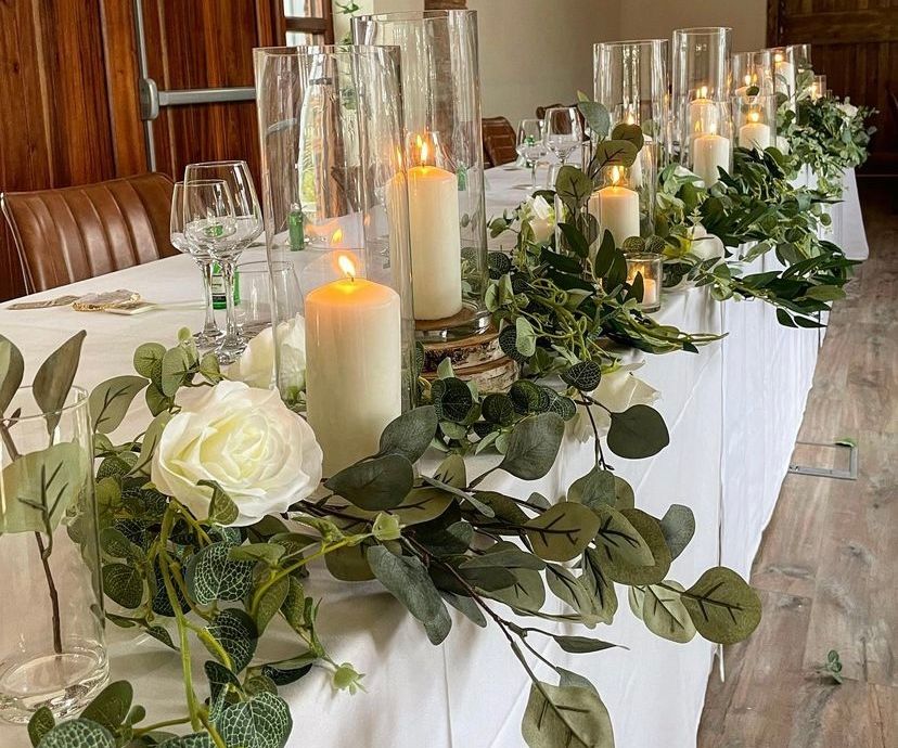 Wedding top table candles flowers and foliage venue stylists Cheshire