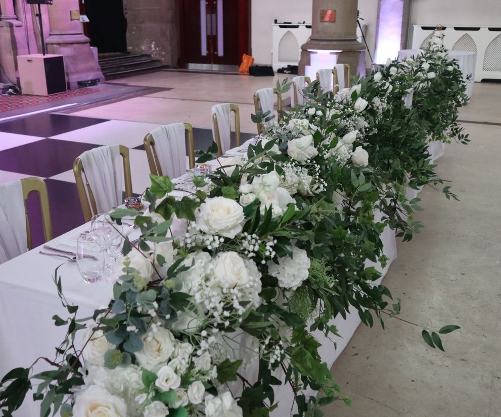 Wedding top table floral arrangement with foliage Cheshire florists