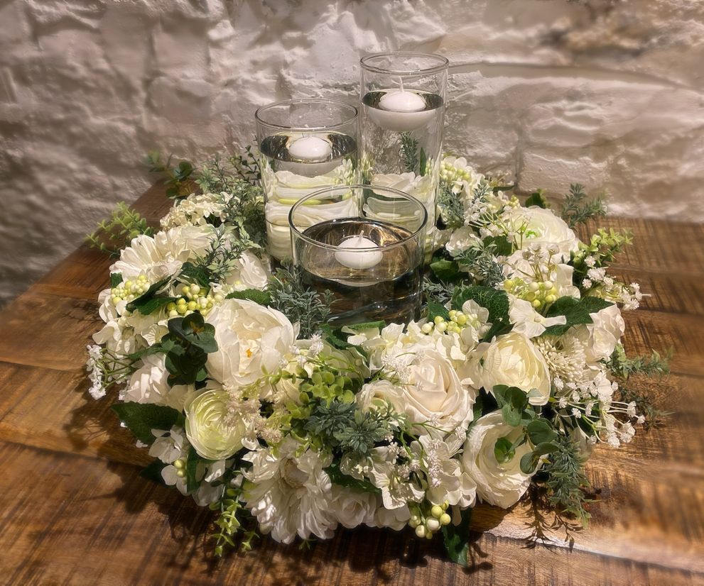 Cylinder vase wedding centre piece with candles and flowers Cheshire
