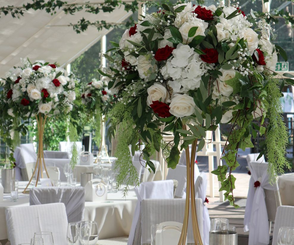 Red rose tall wedding centre pieces Cheshire venue dressers 