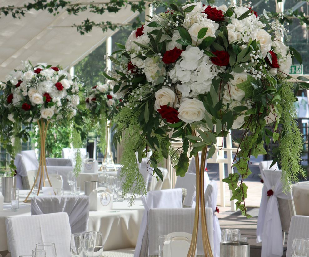 Red rose tall wedding centre pieces Cheshire venue dressers 