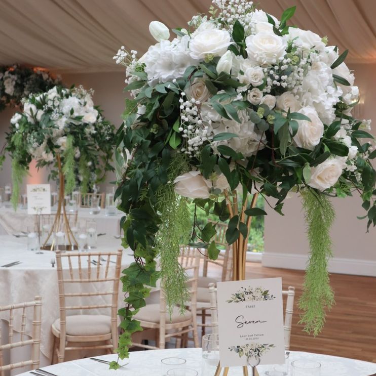Tall white table centre pieces with greenery to hire in Cheshire